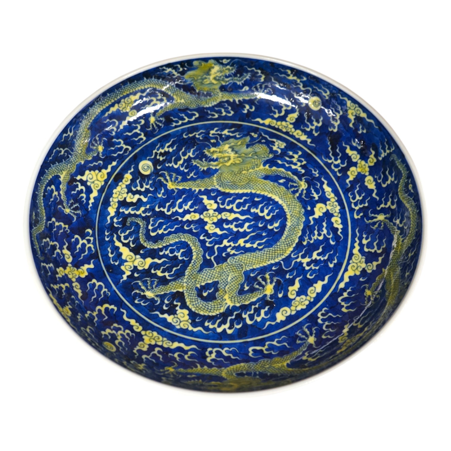 A Chinese blue and yellow glazed dragon dish, 33cm diameter., Condition - good